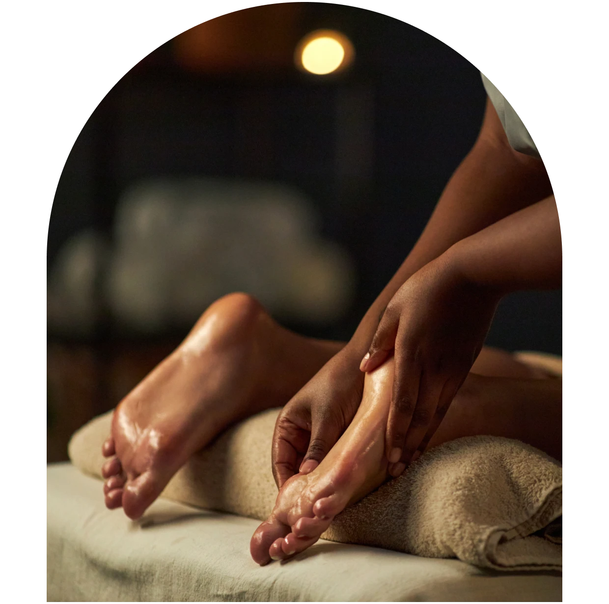 Hands massaging feet gently