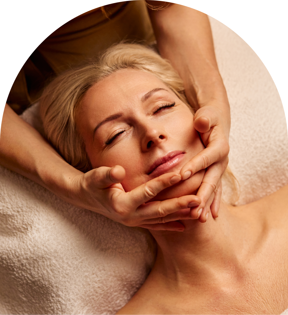 Woman receiving relaxing facial massage